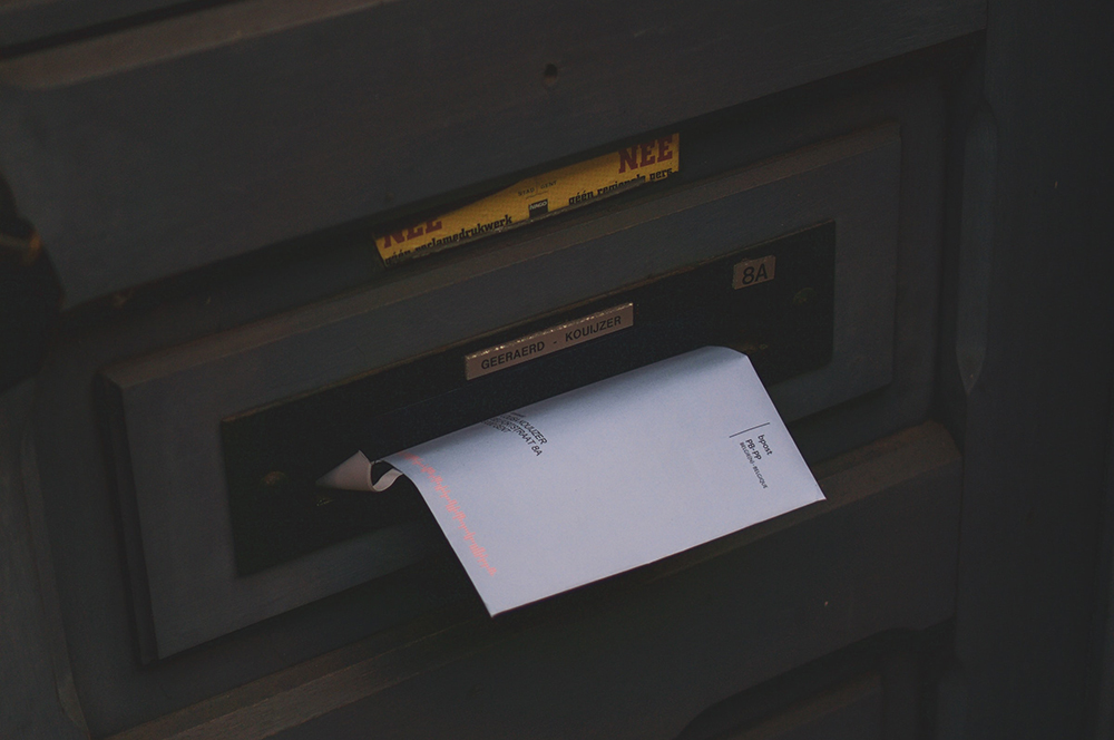 franked envelope in letter box