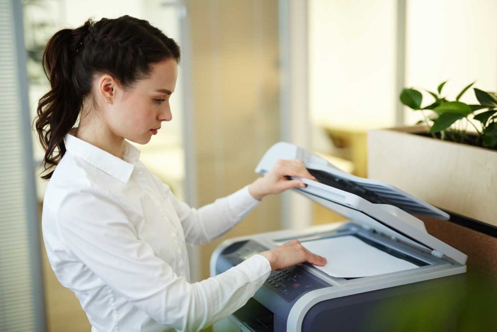 woman using photocopier